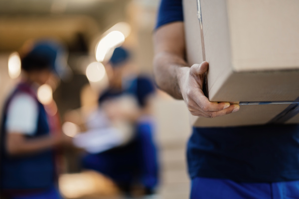 Guy carrying a box